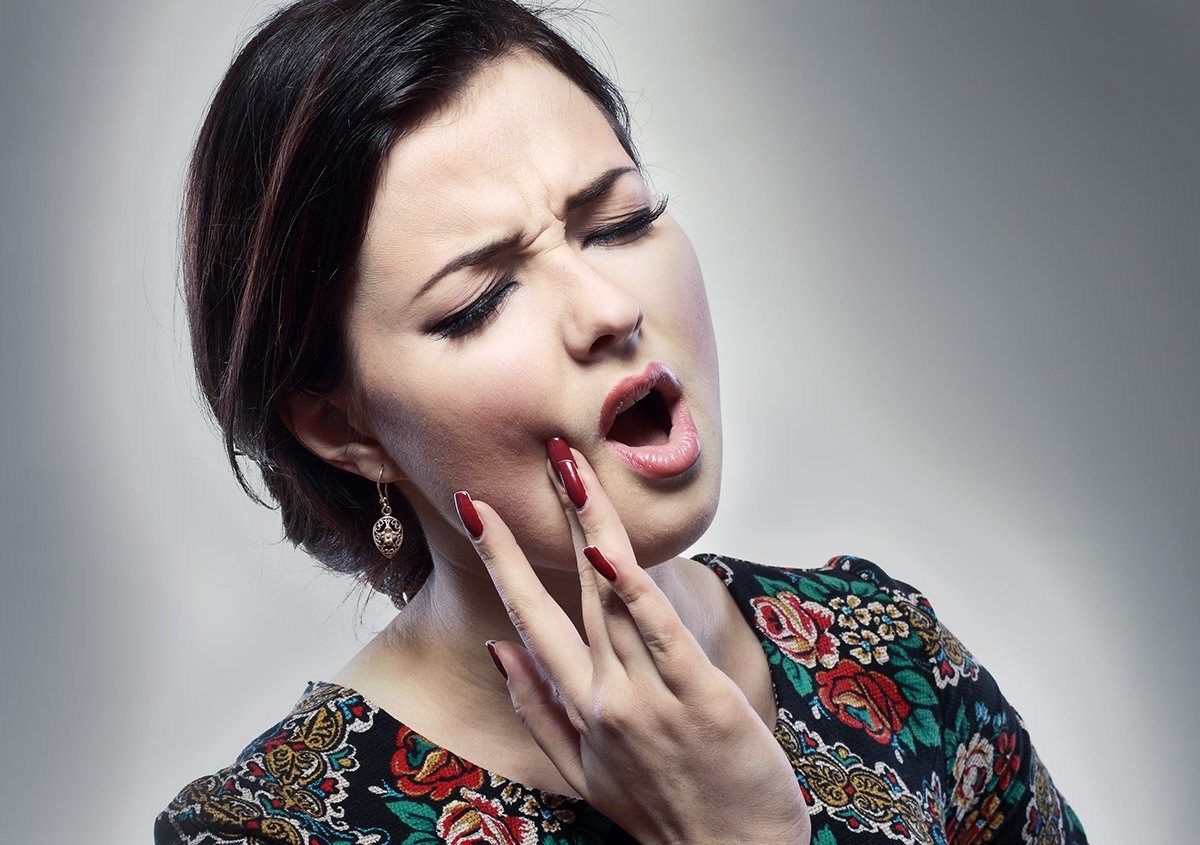 Woman having toothache